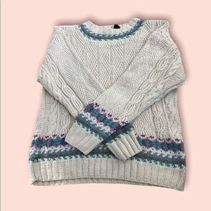 Thick cable knit cream sweater. Blue, green, pink and purple detailing.
